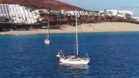 Aerial flyover above Morro Jable - Coast of Fuerteventura Canary Islands 動画素材 335509461