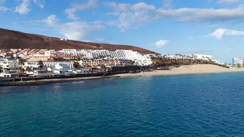 Aerial flyover above Morro Jable - Coast of Fuerteventura Canary Islands 動画素材 335509505