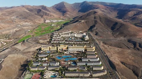 Aerial flyover above Morro Jable - Coast of Fuerteventura Canary Islands Видео 335509539