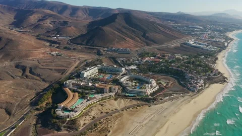 Aerial flyover above Morro Jable - Coast of Fuerteventura Canary Islands Видео 335509550