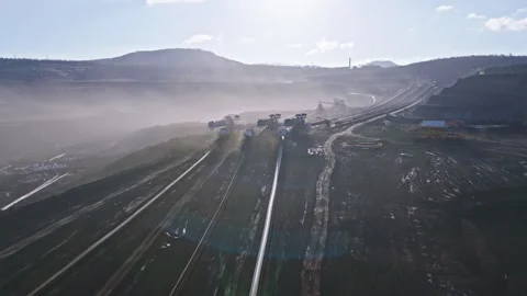 Aerial flyover of an active open pit coal mine Stock Footage 325214335