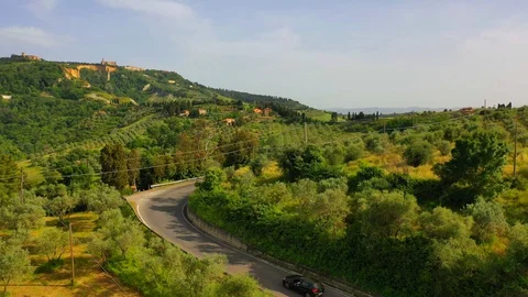 Aerial flyover the beautiful sunset landscape in Tuscany, Italy. Stock Footage 128757853
