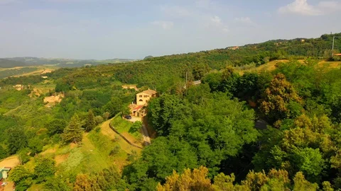 Aerial flyover the beautiful sunset landscape in Tuscany, Italy. Stock Footage 128758131