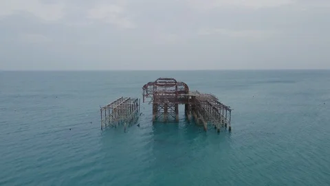 Aerial flyover of Brighton's West Peir in Summer Stock Footage