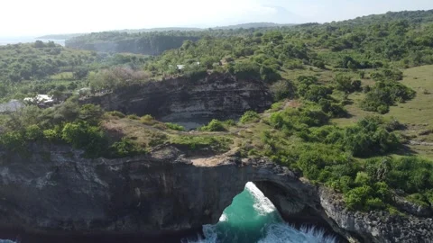 Aerial flyover into Broken Beach Stock Footage 329383917