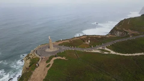 Aerial flyover from Cabo da Roca cross towards the ocean, Portugal, 4K 60fps. Stock Footage 333361920