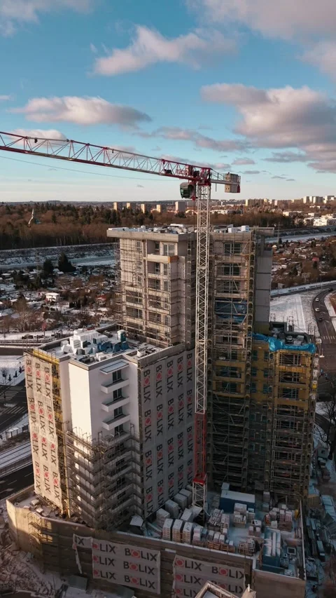 Aerial flyover of construction high-rise site in Szczecin Stock Footage 326234232