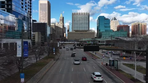 Aerial flyover downtown of Baltimore with multi-lane traffic, modern office Stockbeeldmateriaal 327452786