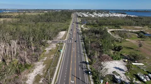 Aerial flyover intersection road of Bradenton town, Florida. Sunny day in USA Stock Footage 305041170