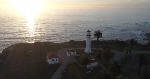 Aerial Flyover Lighthouse by Ocean on a Cliff at Twilight in Palos Verdes Califo Stock Footage 89036754