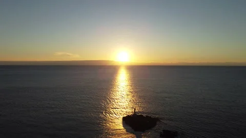 Aerial flyover lighthouse at sunset Stock Footage 168492063