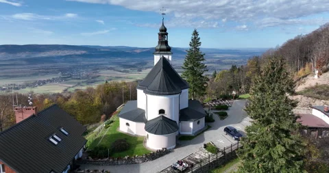 Aerial flyover of Maria Śnieżna Sanctuary on Igliczna in autumn Stock Footage 346663353
