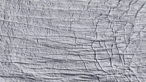 Aerial flyover over the Gorner glacier in Zermatt, Switzerland with a pan up Stock Footage 334641328