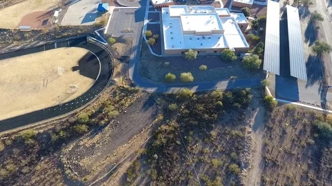 Aerial flyover of a public school campus Stock Footage 71247551