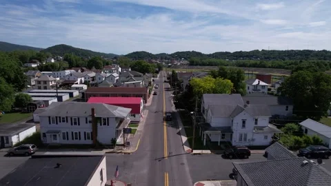 Aerial flyover of road going through small town America Stockbeeldmateriaal 242356373