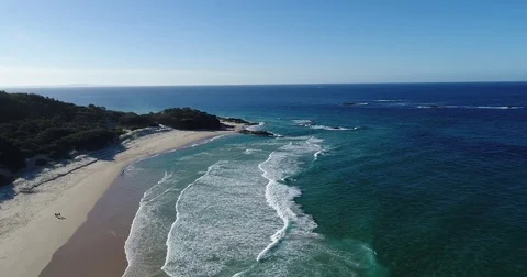 Aerial flyover of rolling waves and beach Stock Footage 78328142