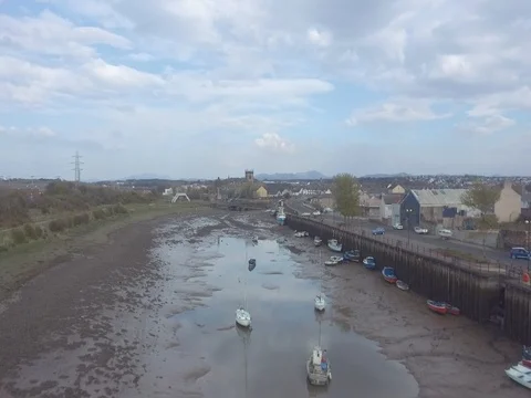 Aerial Flyover of Small Harbor Area with Tide Out (2k 29.97fps) Stock Footage 70790534