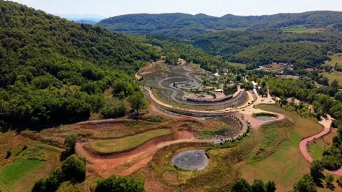 Aerial Flyover of Starry Night Park near Visoko with Spiral Swirls and Ponds Stock Footage 342938784