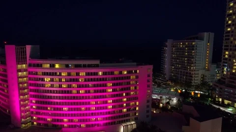 Aerial flyover tilt down reveal Fontainebleau Hotel Miami Beach Stock Footage