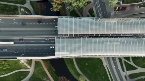 Aerial flyover traffic roadway intersection in city. Cars driving busy highway Stock Footage 193723827