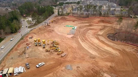 Aerial flyover view of construction site with heavy equipment Video stock 126047721