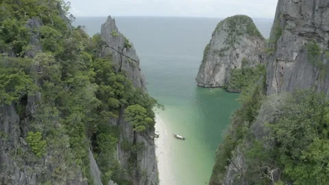 Aerial Flythrough Between Cliffs Revealing Tropical Beach, Krabi, Thailand Stock Footage 171381447