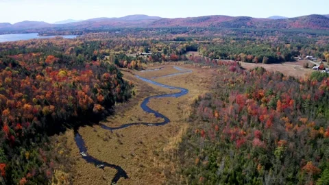 Aerial flythrough of Winding River Through Autumn Trees with Fall Colors in N Stock Footage 169811263