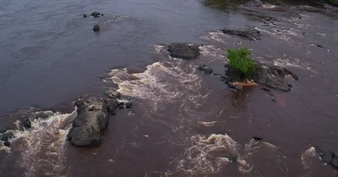 Aerial focus view on rapids brown water between rocks in Africa Gabon 2015 Video stock 82355016