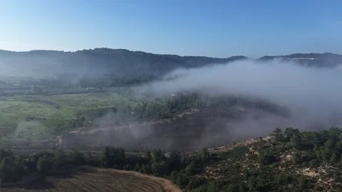 Aerial of Fog Floating out of Valley and Train Driving Through 4k Drone Stock Footage 294097341
