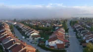 Aerial: Foggy Morning In Idyllic Suburban Town Stock Footage