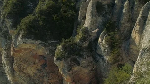 Aerial follow flying soaring eagle bird of prey over rocky mountains Wildlife 4k Stock Footage 150991951