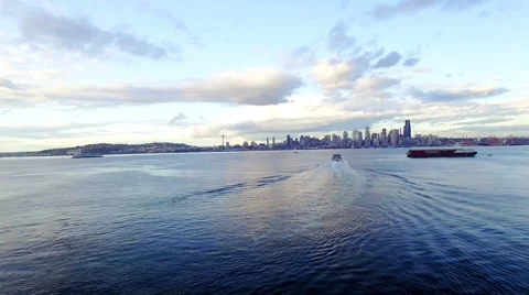 Aerial Following Ferry Boats Moving Towards Downtown Seattle Skyline at Sunset Stock Footage