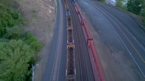Aerial Following Train From Train Yard  Stock Footage 248664109