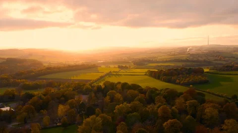 Aerial footage Autumn sunset - English Countryside Yorkshire Sculpture park, UK Stock Footage 119580564