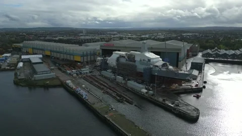 Aerial footage of BAE Systems shipyard in Glasgow, Scotland, UK Stock Footage 219028202