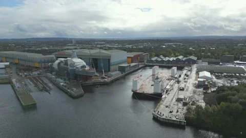 Aerial footage of BAE Systems shipyard in Glasgow, Scotland, UK Stockbeeldmateriaal 219028207
