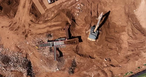 Aerial footage of Bagger loading unfiltered sand into Sand cleaning crusher Stock Footage 237501966