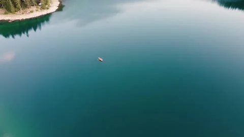 Aerial Footage of A Boat Floating on  Beautiful Mountain Lake Stock Footage