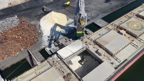 Aerial footage of a bulk cargo ship being loaded with dry material Stock Footage 343050807