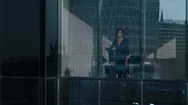 Aerial Footage Of The Businesswoman Looking Out Of The Window. Stock Footage