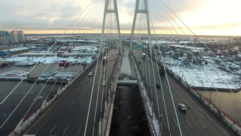 Aerial footage of a cable-stayed bridge, ice moving along the river Stock-Footage 172541217