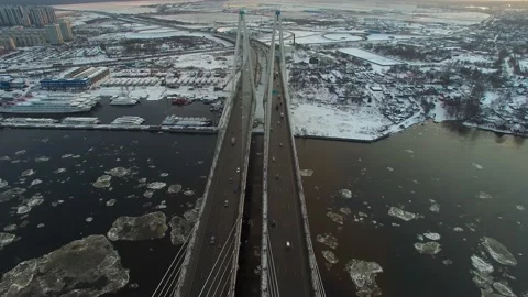 Aerial footage of a cable-stayed bridge, ice moving along the river Stock-Footage 172541324