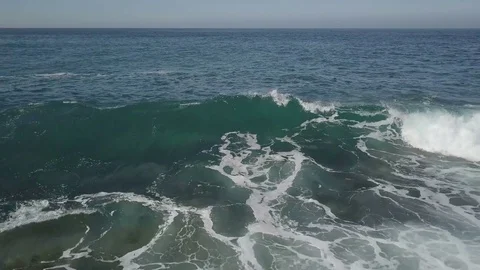 Aerial footage camera flight in front of the wave with a lot of ocean foam Stock Footage 84721750