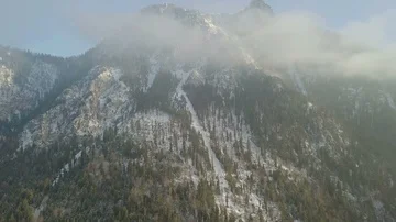 Aerial footage camera flight underneath the clouds towards the mountains Stock Footage 86137316