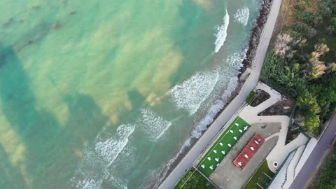 Aerial footage, camera pointing down at waves and sun beds. Vasto Marina, Italy Stock Footage 156023134