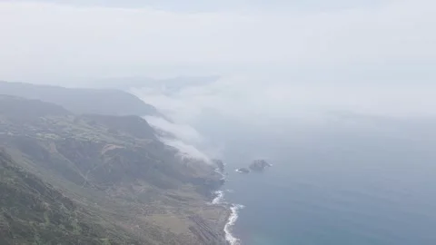 Aerial footage captures the dramatic cliffs and rugged coastline around Garita Stock Footage 346719612