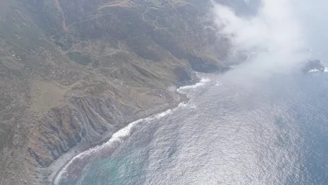 Aerial footage captures the dramatic, rocky coastline near Garita da Herbeira in Stock Footage 346707654