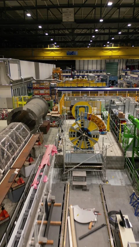 Aerial footage of the CERN research center, Large Magnet Facility, Industrial Stock Footage 260800341