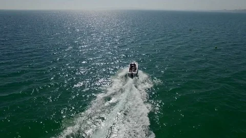 Aerial footage chasing a speedboat at sea 스톡 동영상 71663605