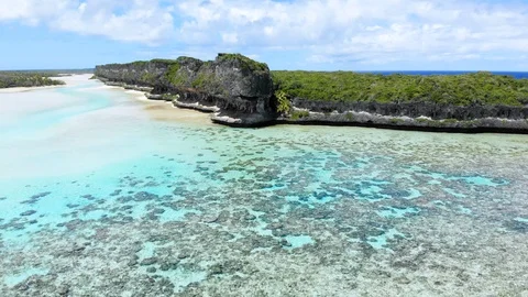 Aerial footage: Cliffs of Lekiny in the same lagoon as Mouli bridge. Ouvea. 動画素材 126609661
